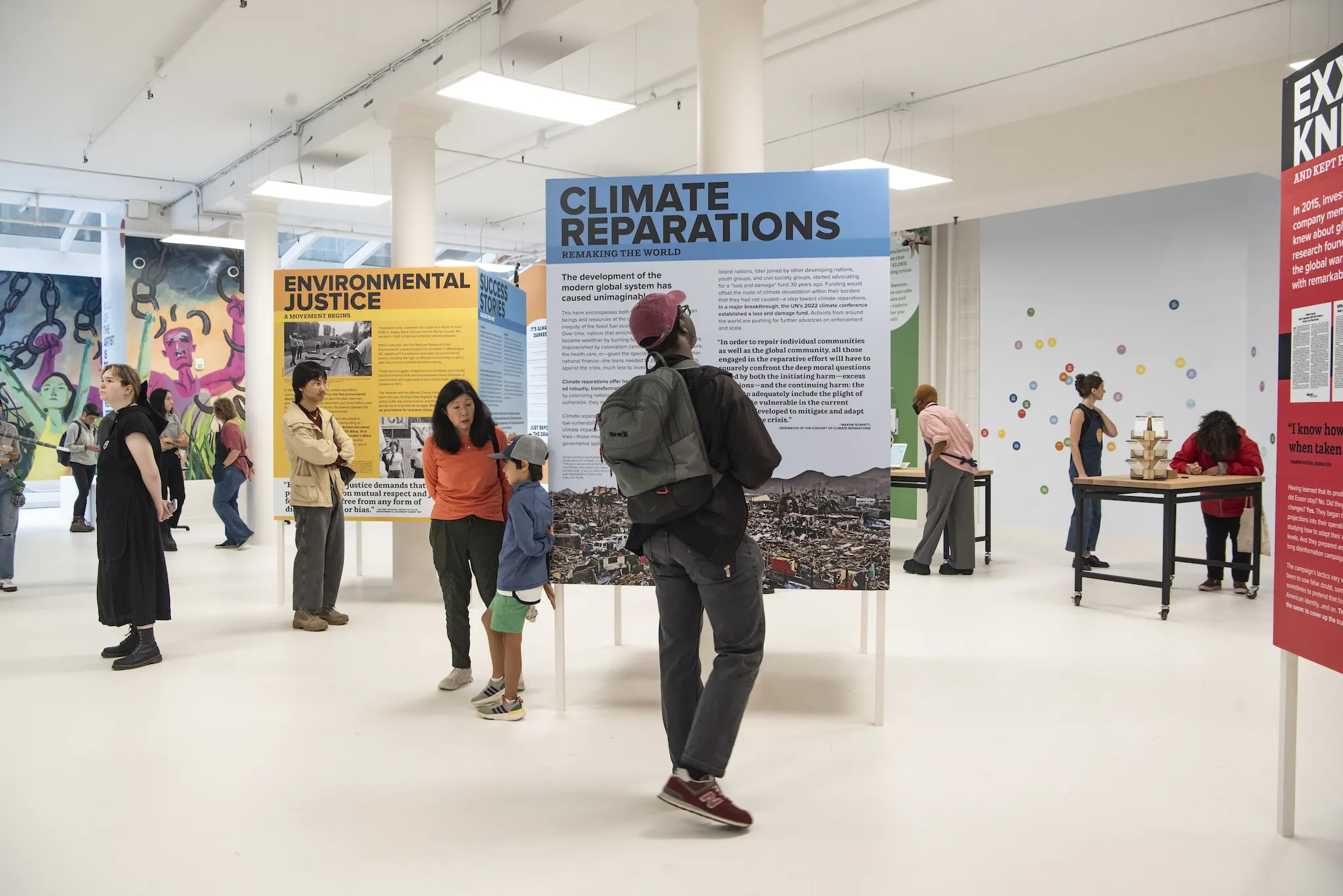 People look at posters inside the Climate Museum.