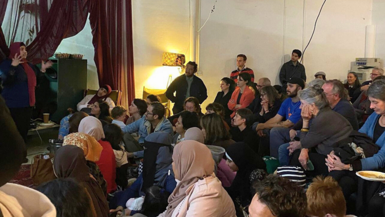 A speaker talking to a intimate crowd