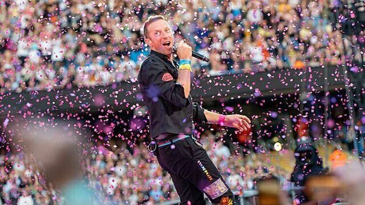 chris martin on stage for music of the spheres world tour