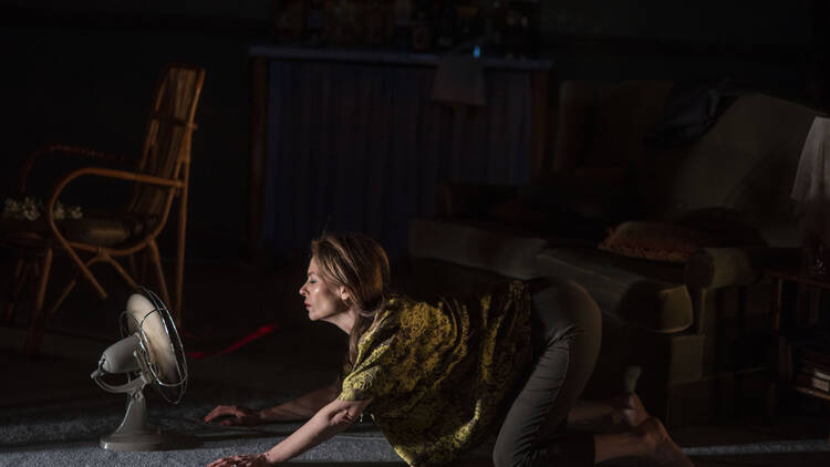 Kat Stewart lying in front of a fan in a scene from 'Who's Afraid of Virginia Woolf'.