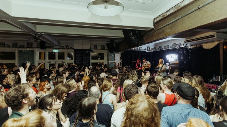 Punters watching a band at The Vic On The Park