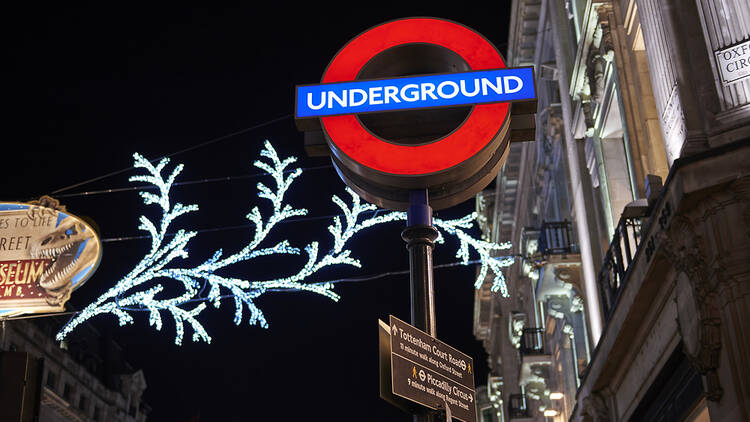 Tube station sign at Christmastime, London