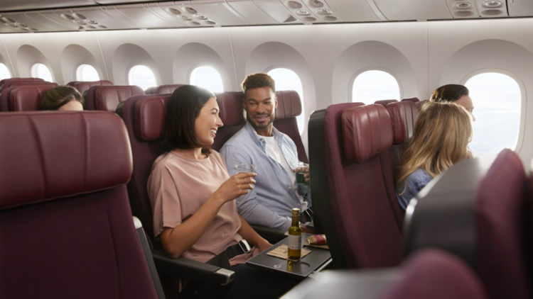 People having wine on a plane