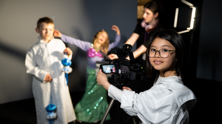 Kids filming a video