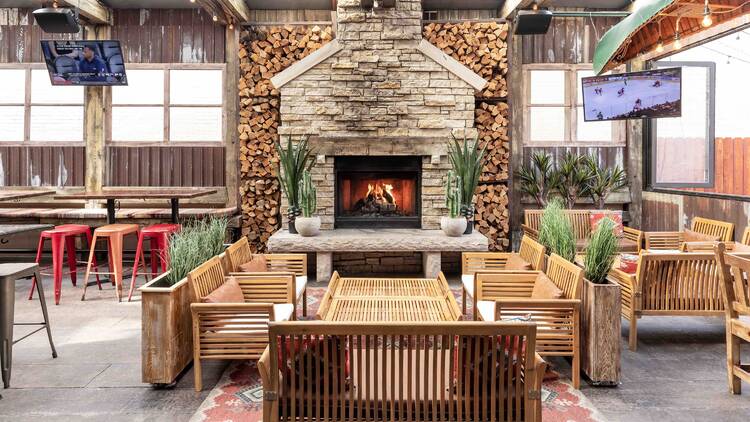 Frontier's patio featuring a fireplace