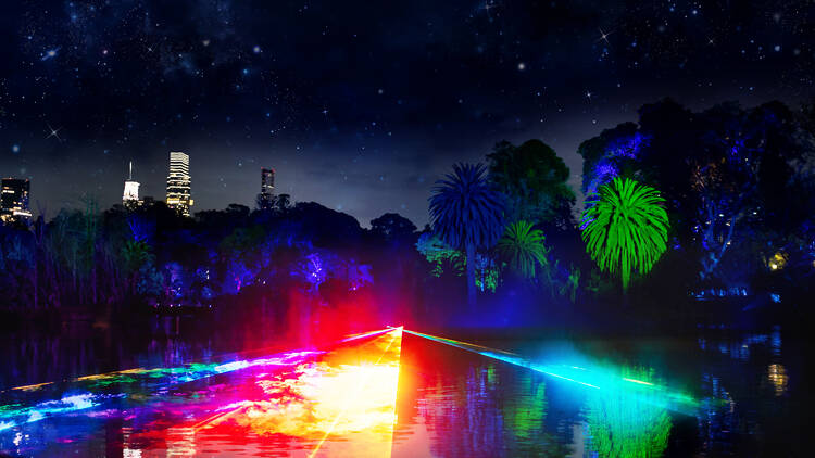Glowing rainbow lights over a lake in the Royal Botanic Gardens.