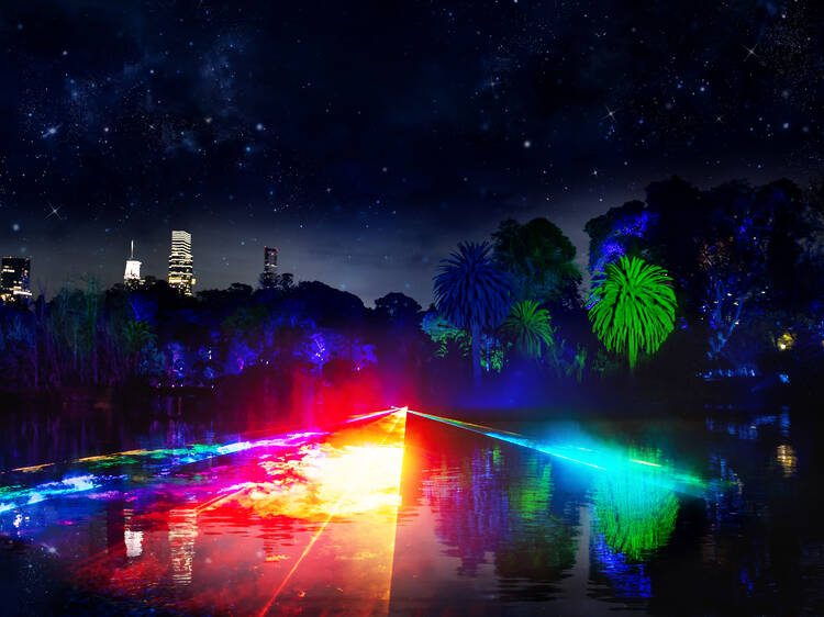 Glowing rainbow lights over a lake in the Royal Botanic Gardens.