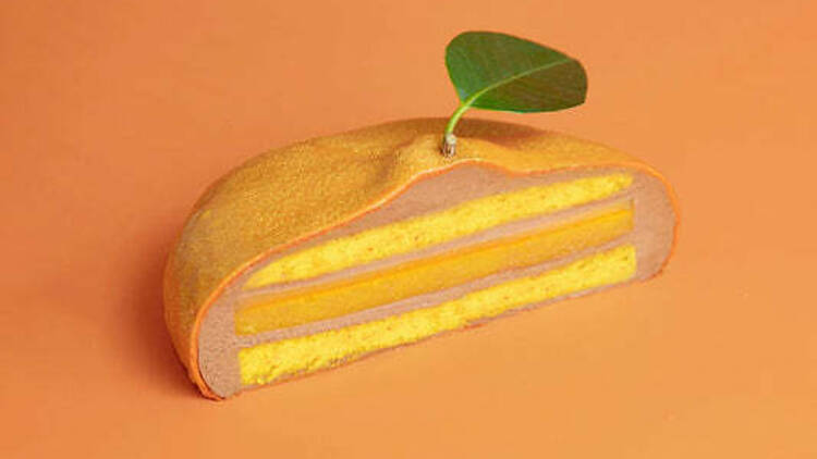 Sliced open mandarin layer cake.