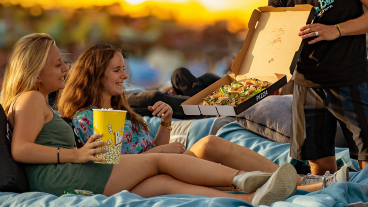 Two girls at an outdoor cinema