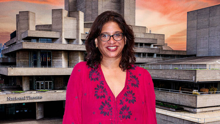 A woman standing in front of national theatre