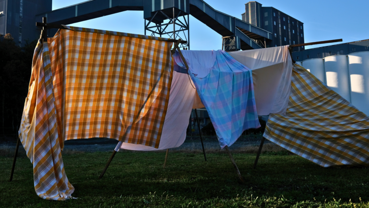 Sheets hanging on a line - art installation