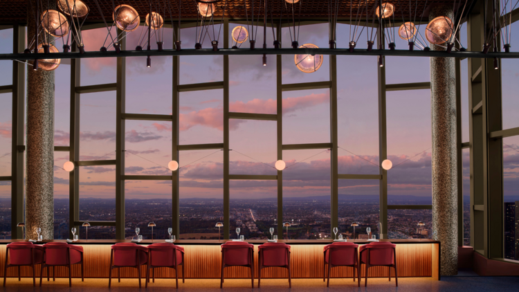 A restaurant with sunset city views.
