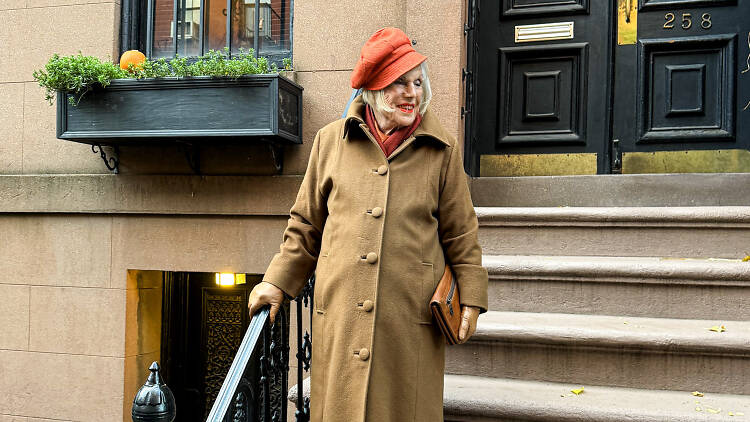 Dorothy Wiggins on the steps of a Brownstone