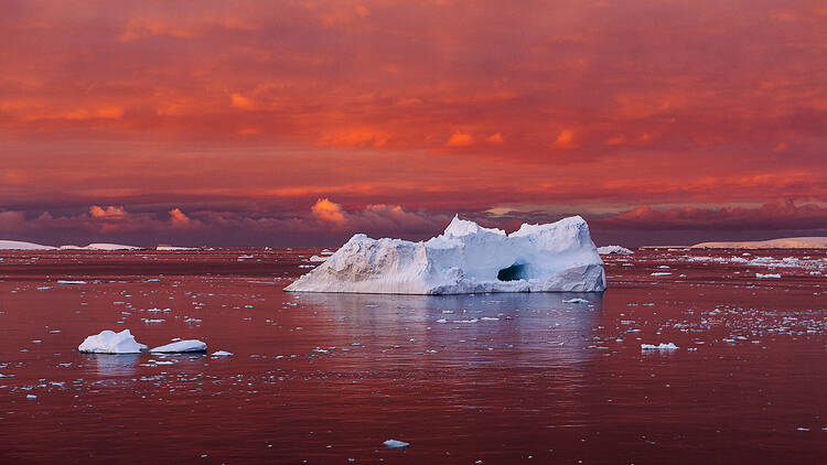 Antarctica 2016, a glacier against a pink sky.