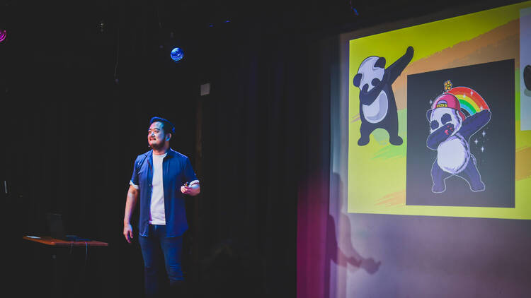 Comedian Ricky Sim on stage.