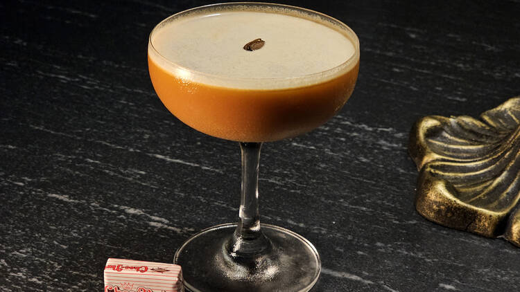 Porto Flip Cocktail On A Bar Desk Black Background Stock Photo