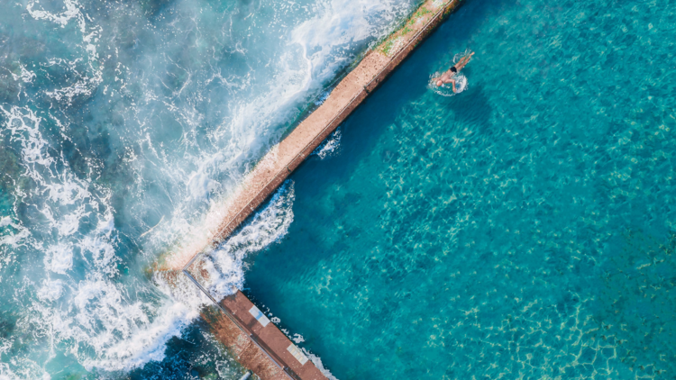 aerial photo of ocean swimming pool