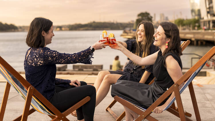people with drinks at sunset in Barangaroo