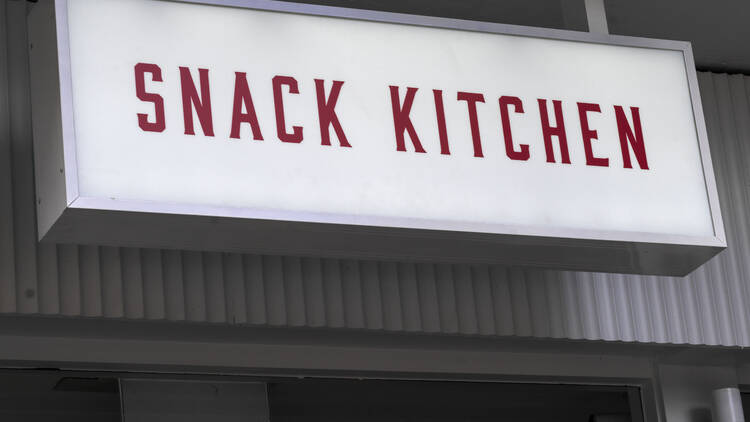 Snack Kitchen's red and white sign
