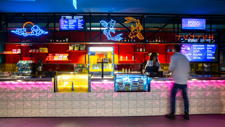 A cinema bar with neon lights