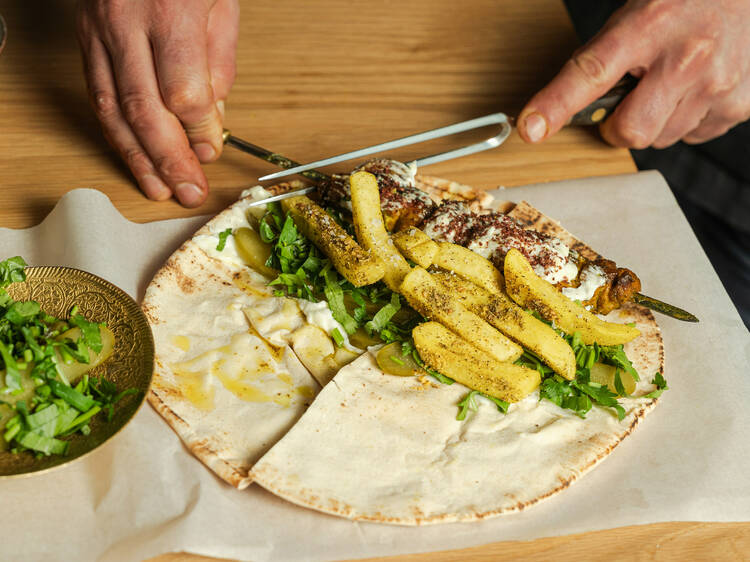 Tom Sarafian's mezze wrap with fries, salad and barbecued meats.