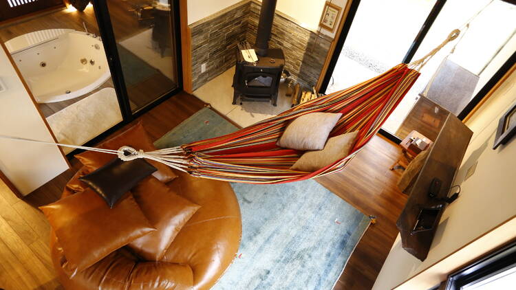 A hammock hanging inside a villa at Glamping Villa Hanz