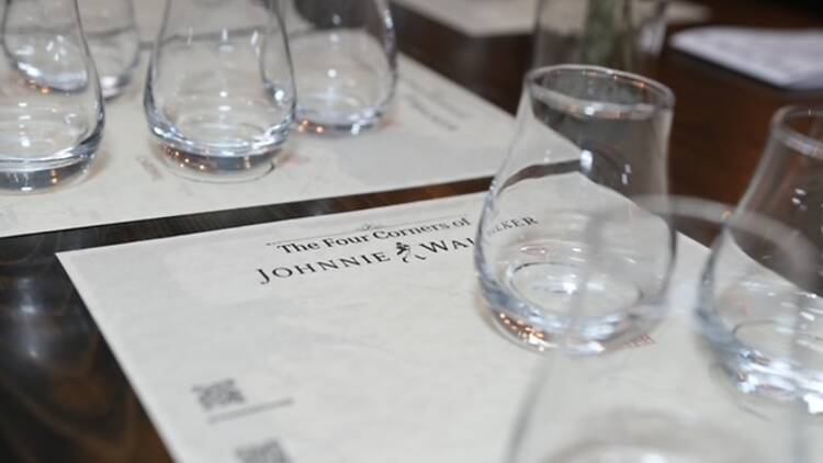 A collection of whiskey tasting glasses on a table.