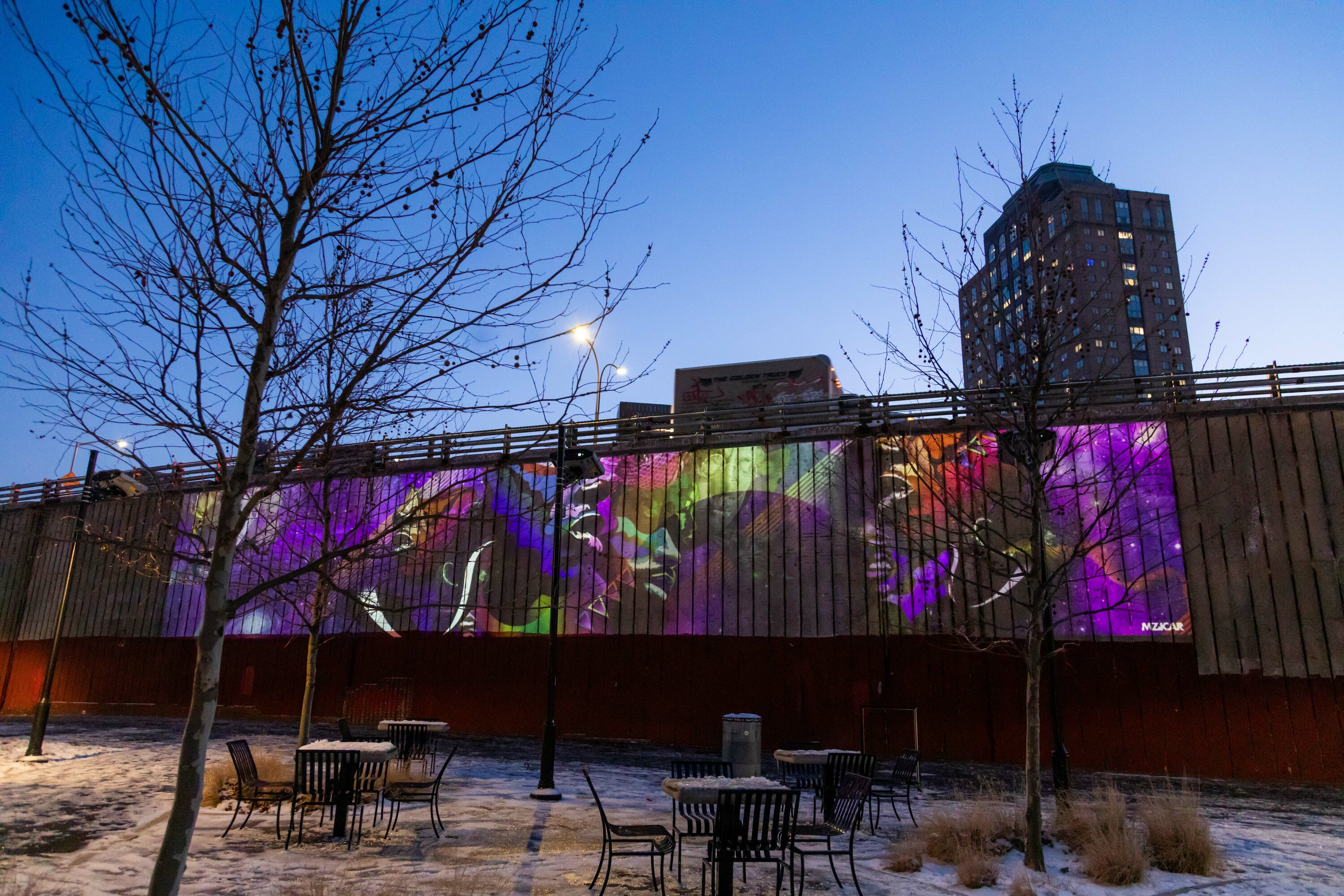 Artwork projected on the side of a highway