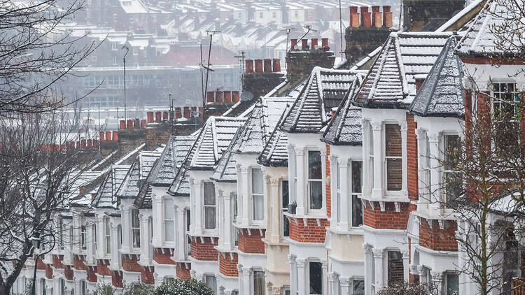 Snow on rows of houses in London