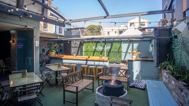 A pub courtyard with a fire pit