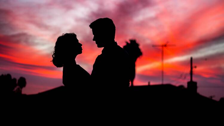 A silhouette of a couple at sunset. 