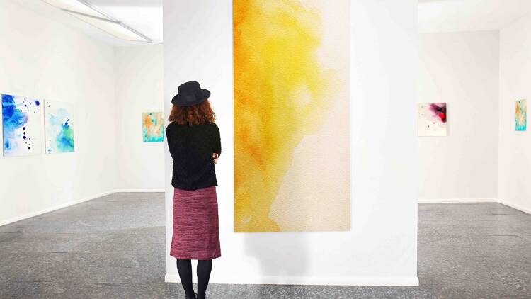 A woman in an art gallery