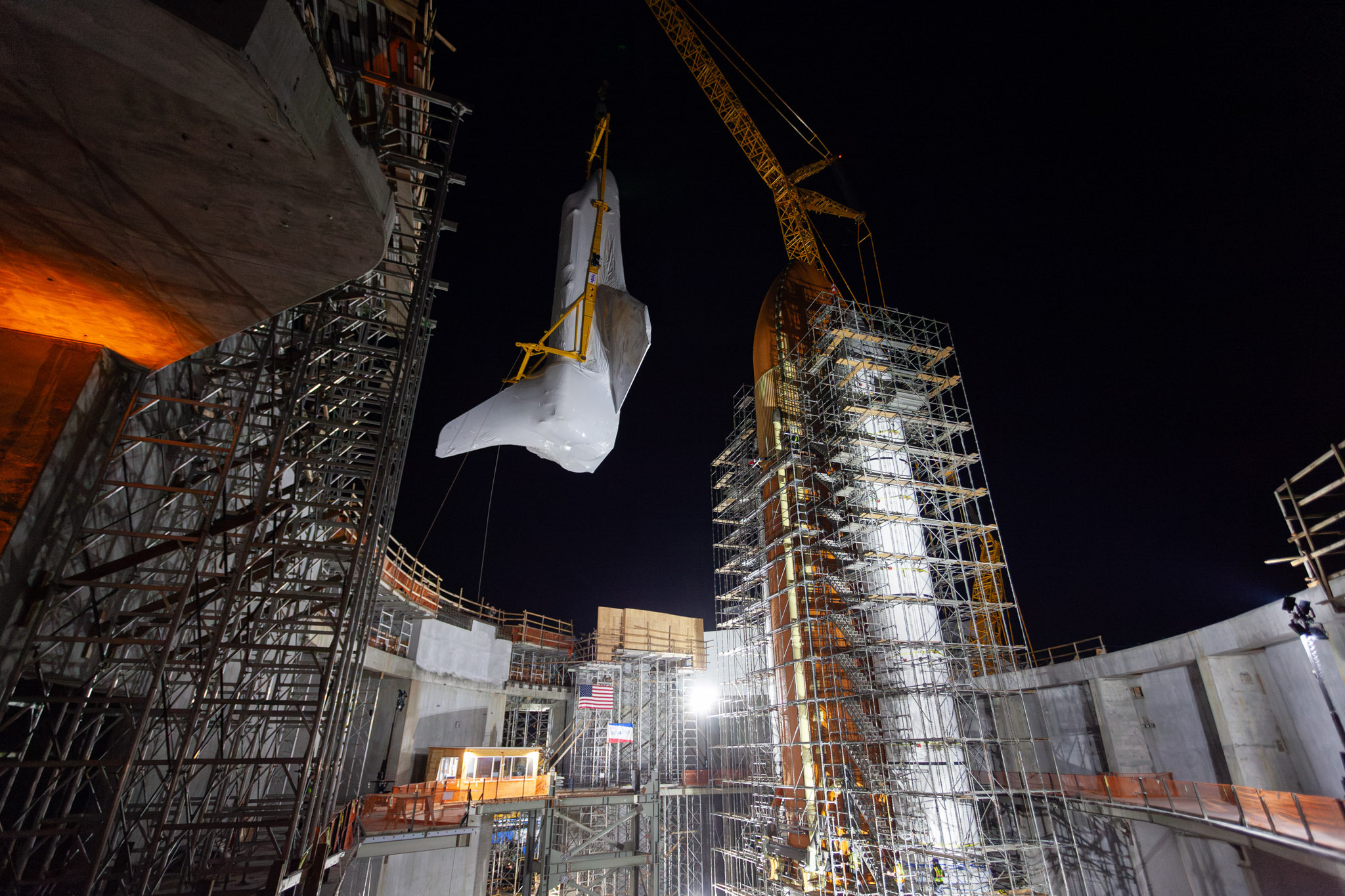 Space shuttle Endeavour fuel tank moving into position 