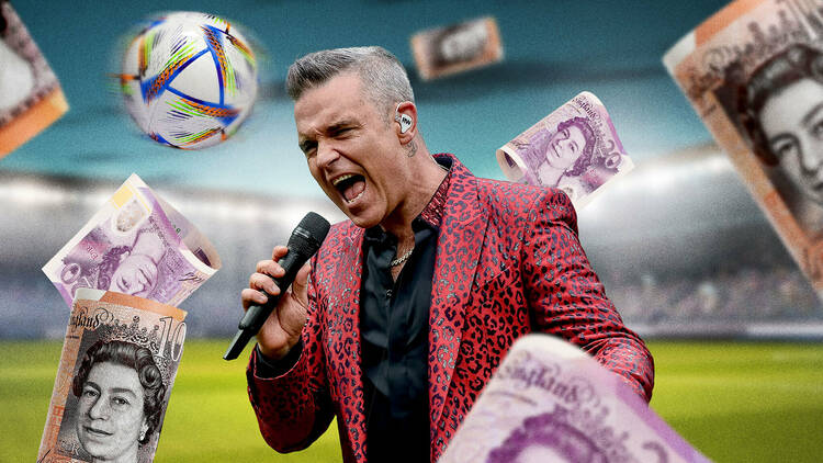 Robbie Williams performing on a football pitch