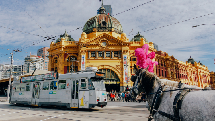 Flinders Street Station with tram and horse.