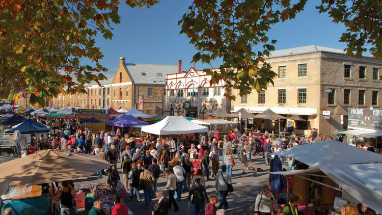 An outdoor market with crowds