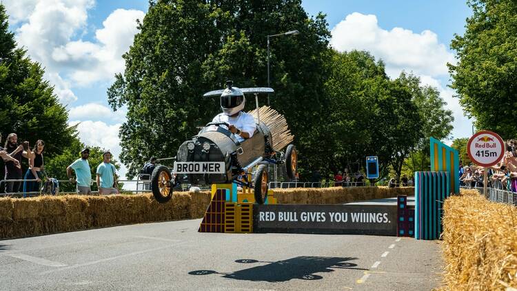 A racer going over a jump at the Red Bull Soapbox race 