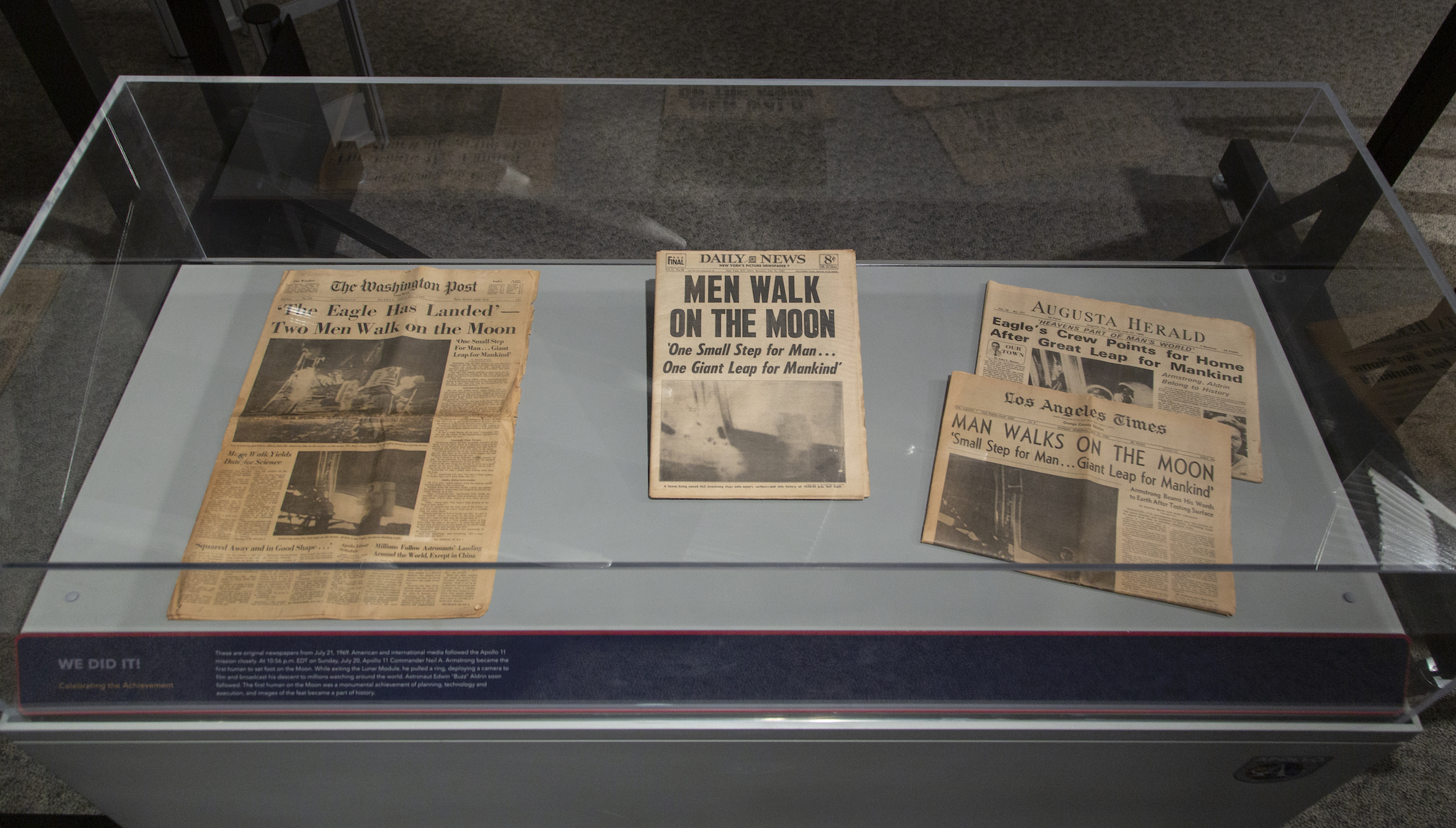 Historic newspapers at the Apollo 11 exhibit.