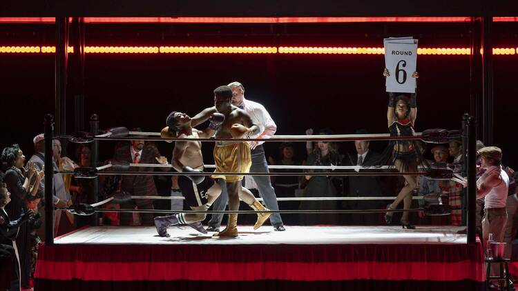 An opera production featuring two boxers in a ring.