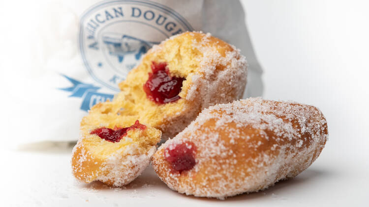 A packet of hot jam doughnuts.