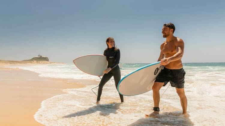 Take a surfing lesson from a professional surfer