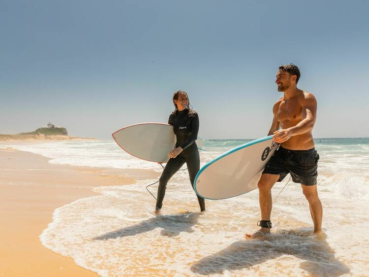 Take a surfing lesson from a professional surfer