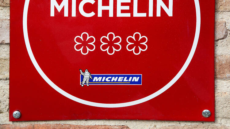 Michelin star sign with three stars