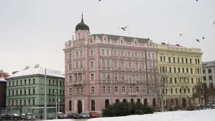 Pink facade of Hotel Opera in the snow. 