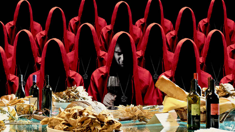 Hooded figures at a dinner table