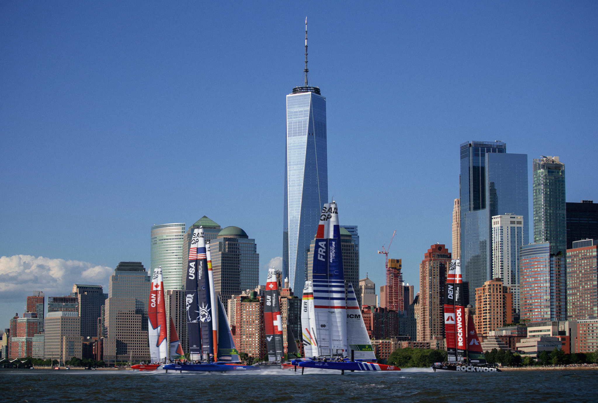 Sail boats in front of the NYC skyline.