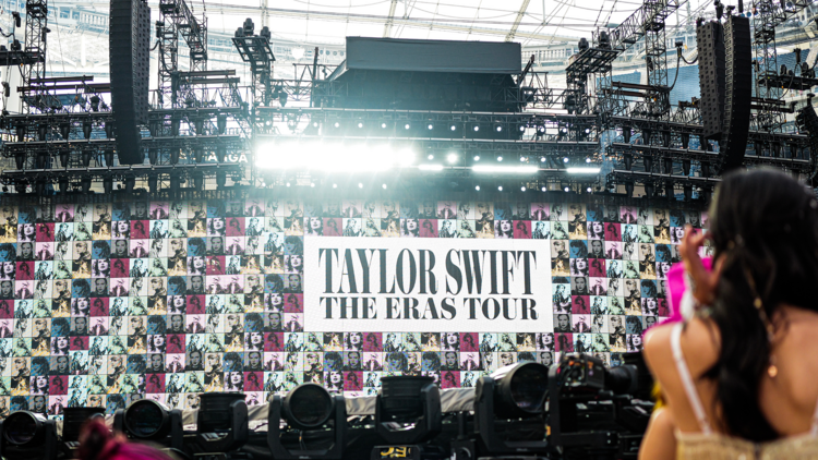 A sign that says: TAYLOR SWIFT - THE ERAS TOUR