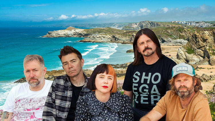 Slowdive band in front of a beachy scene