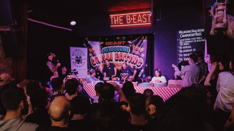 An audience watching competitors in a chilli eating competition at the B.East.