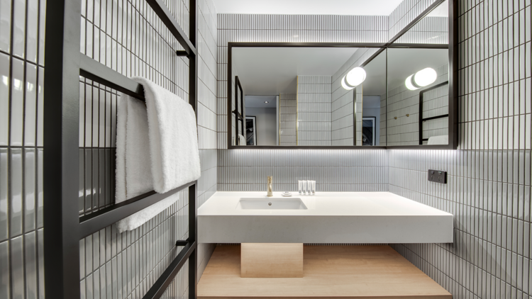 Hotel bathroom sink and mirror